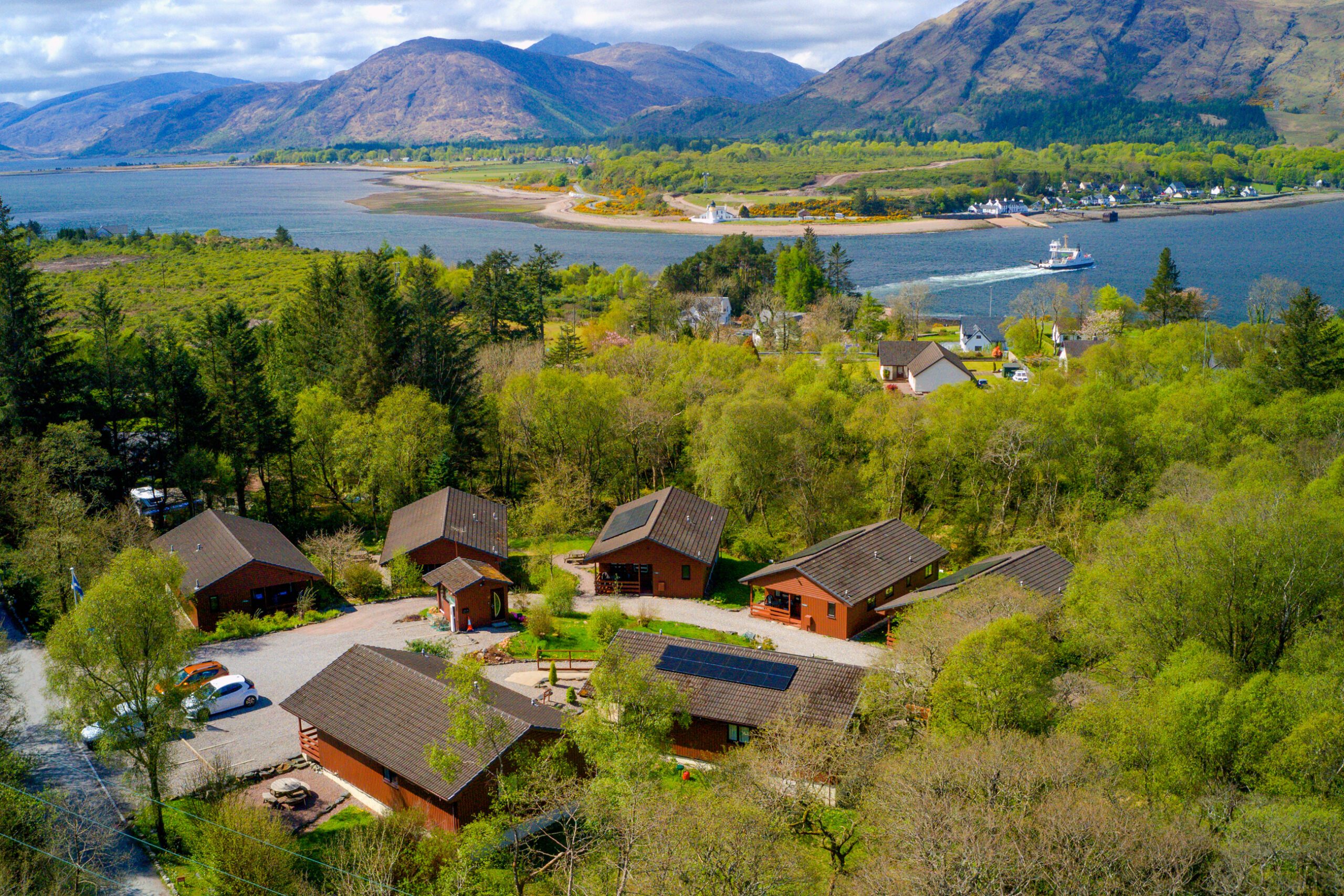 The view looking down on Birchbrae Highland Lodges overlooking the Corran Ferry & Corran Narrows on Loch Linnhe.